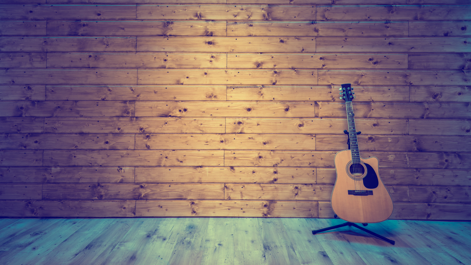 wood background grain and acoustic guitar